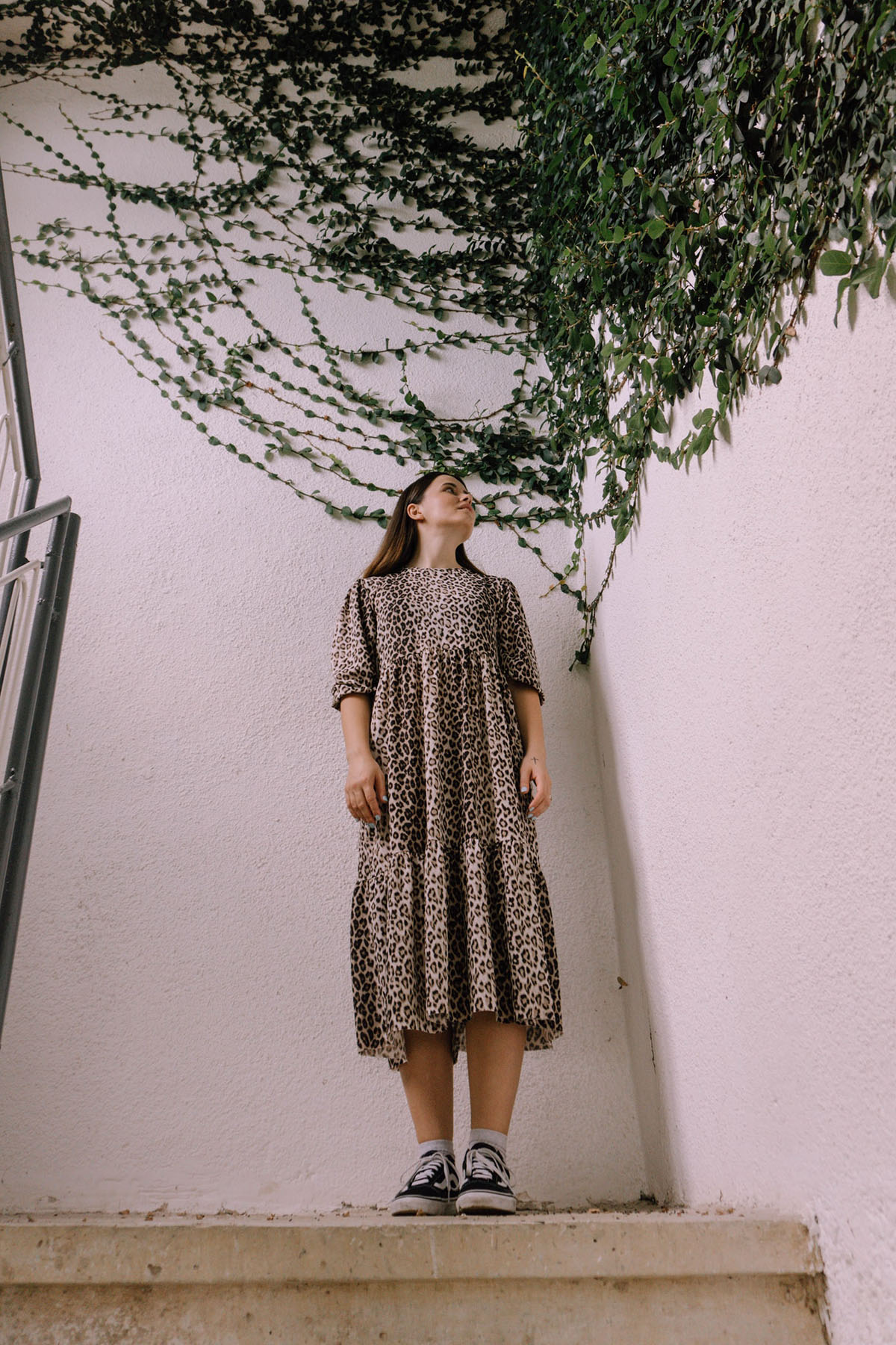 A woman looks stylish with her cheetah printed dress