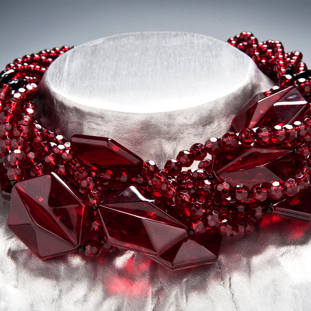 Angela Caputi red glass necklace on display at her shop in Florence