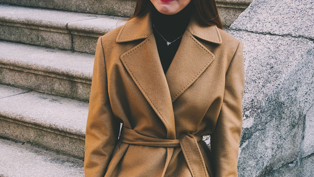 Woman wearing a nice camel coat