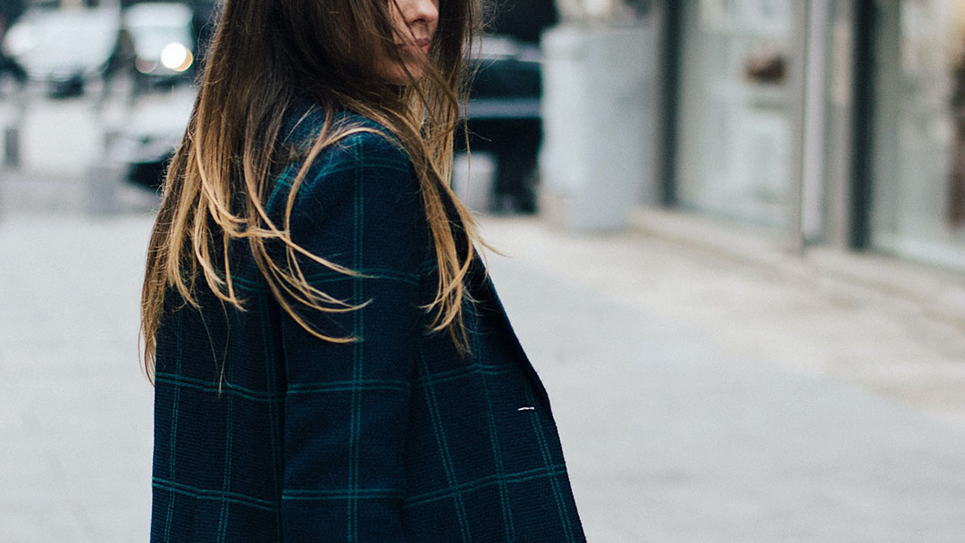 A woman with a checkered coat