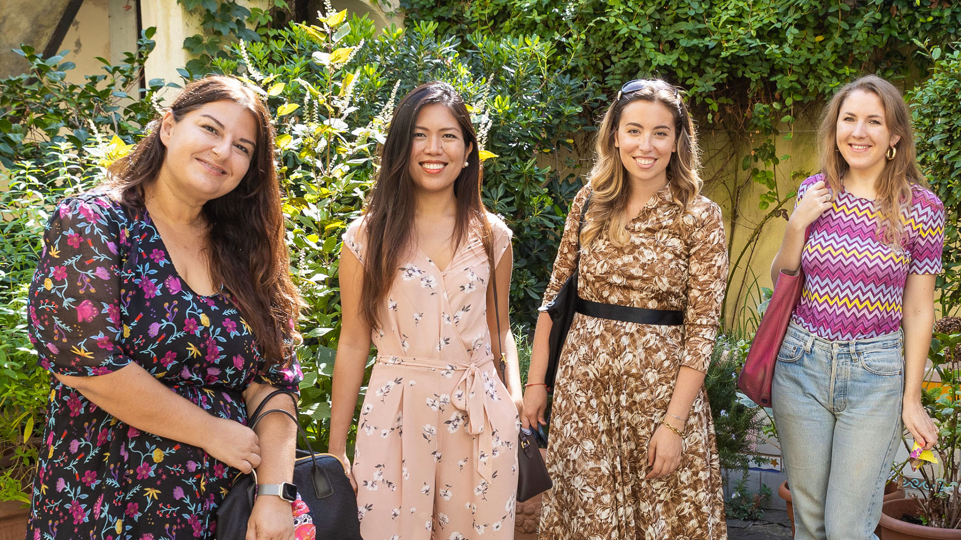 Fashion girls smiling in a Florentine garden