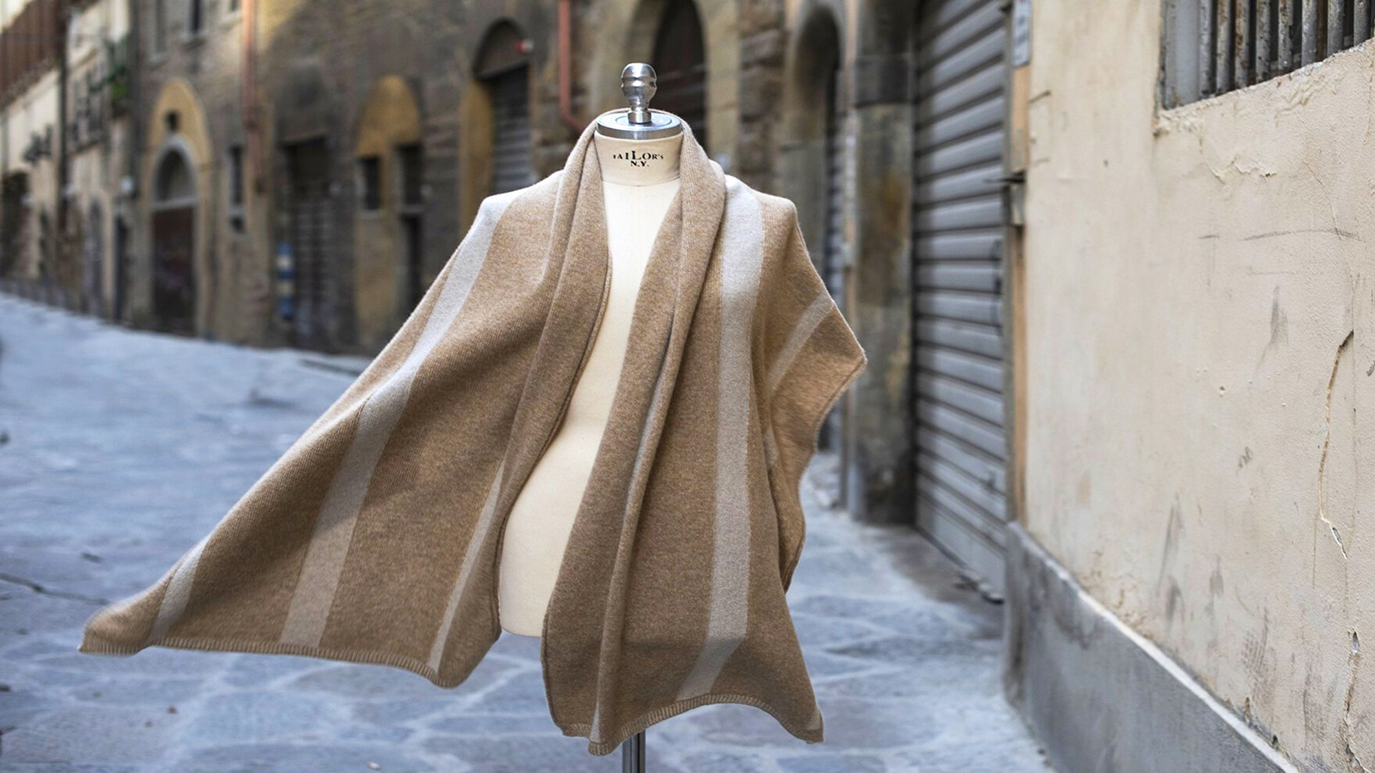 My Pieracci's beige sweater showcased on the street in Florence