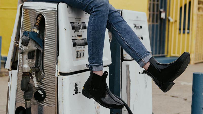 A woman in Florence shows her cool rain boots during fall