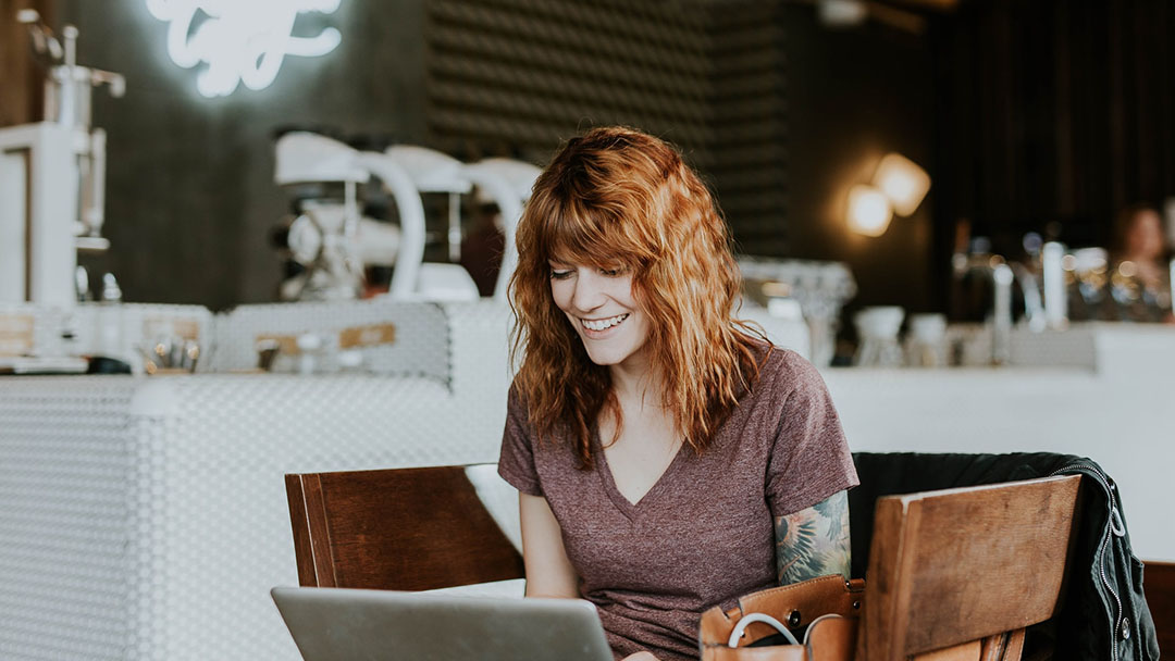 A woman having fun and learning about style online