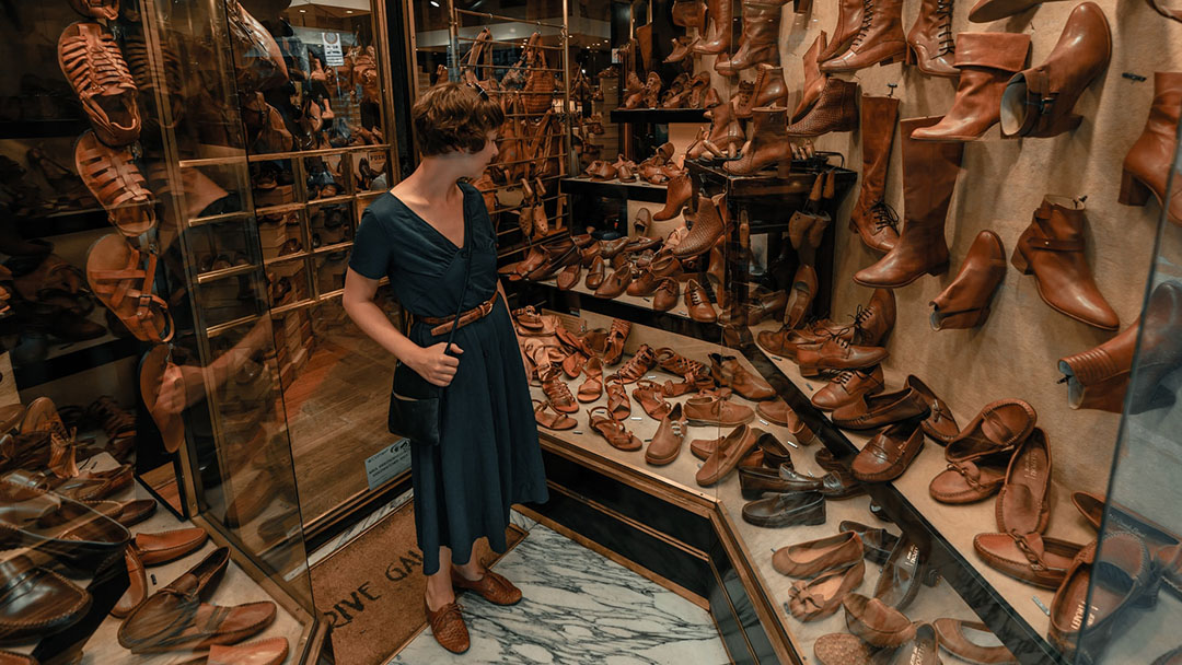 Woman in a leather sandals shop in Florence