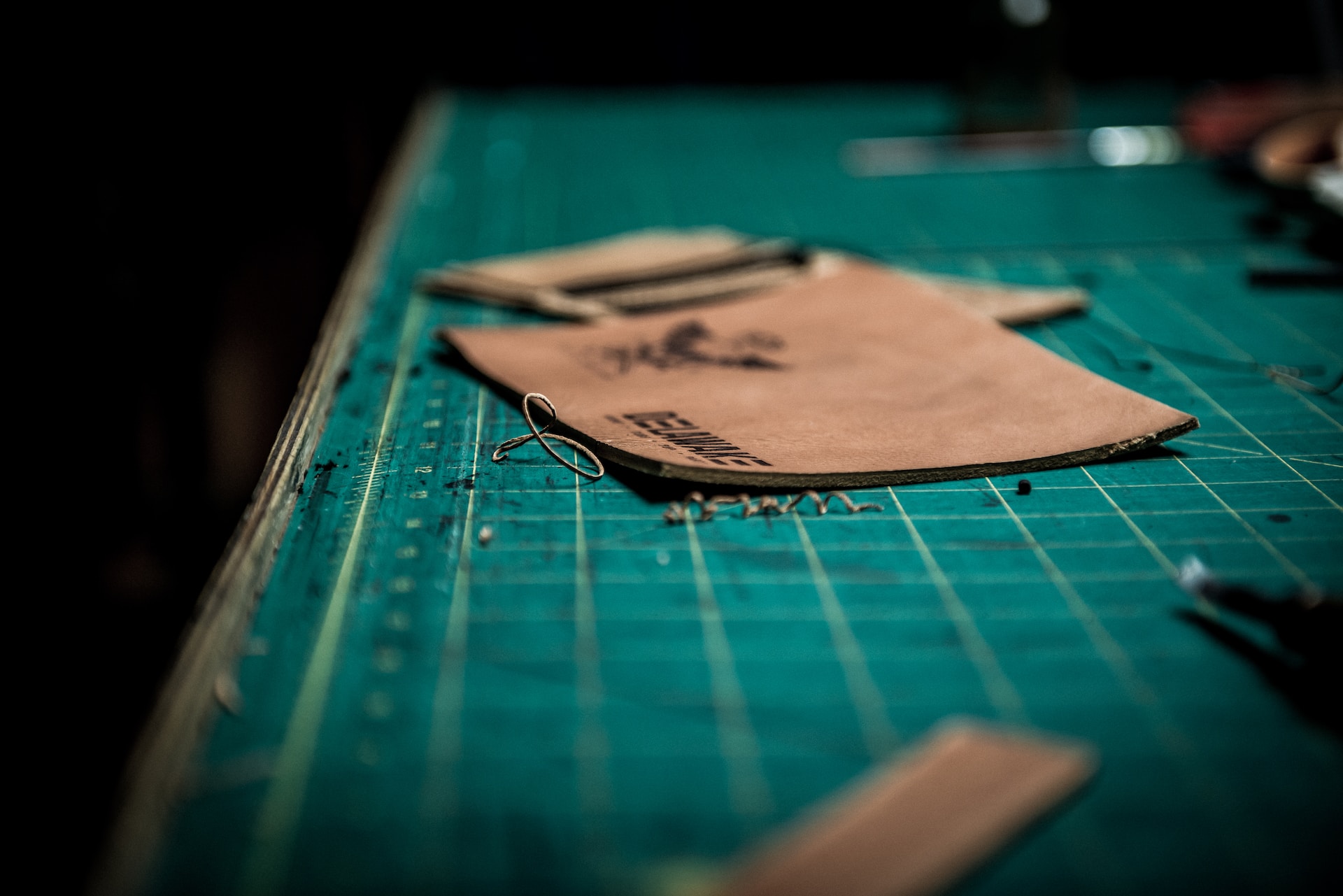 An artisan working during a leather making class