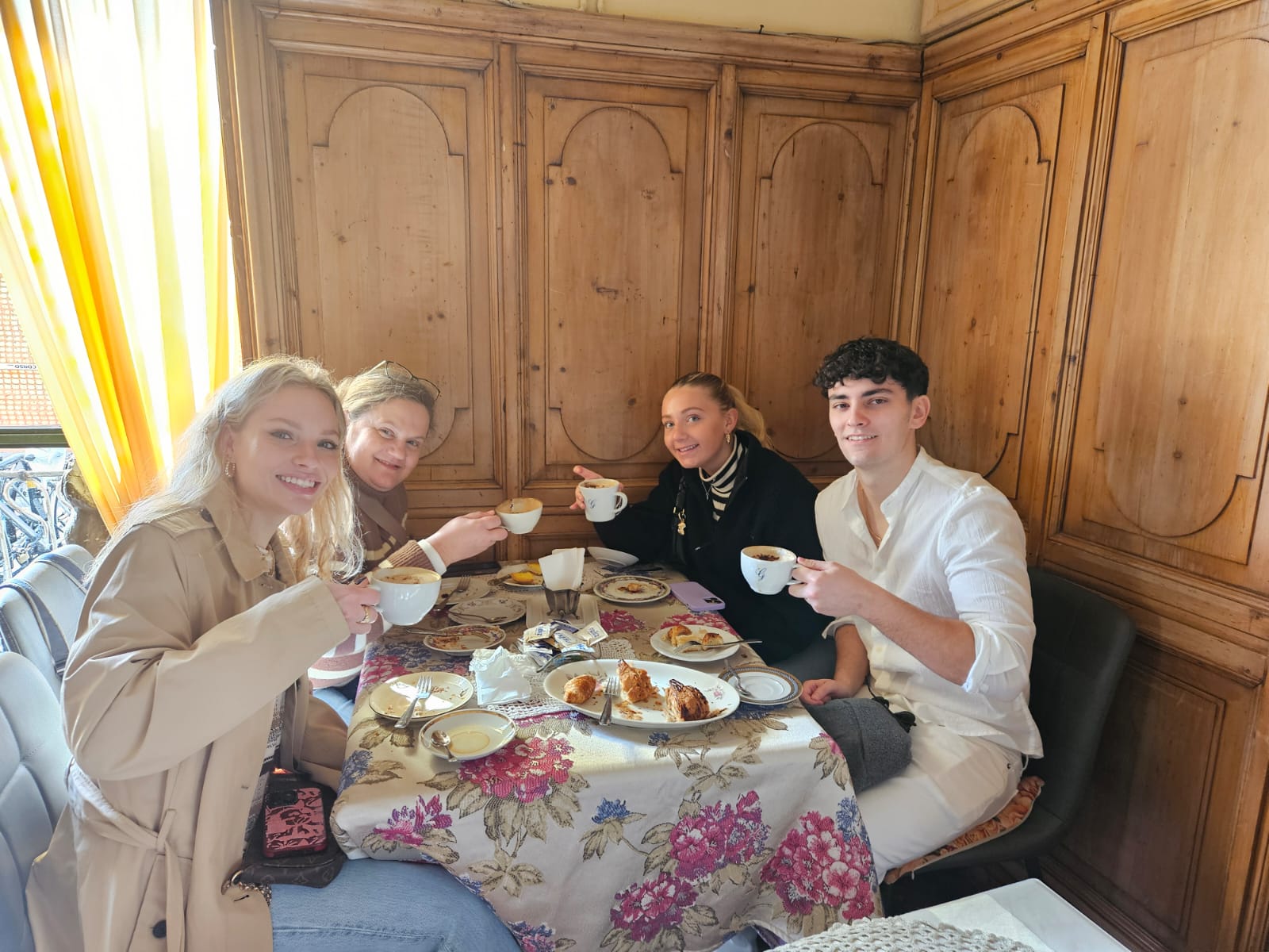 A group has a typical Italian breakfast in Florence, Italy